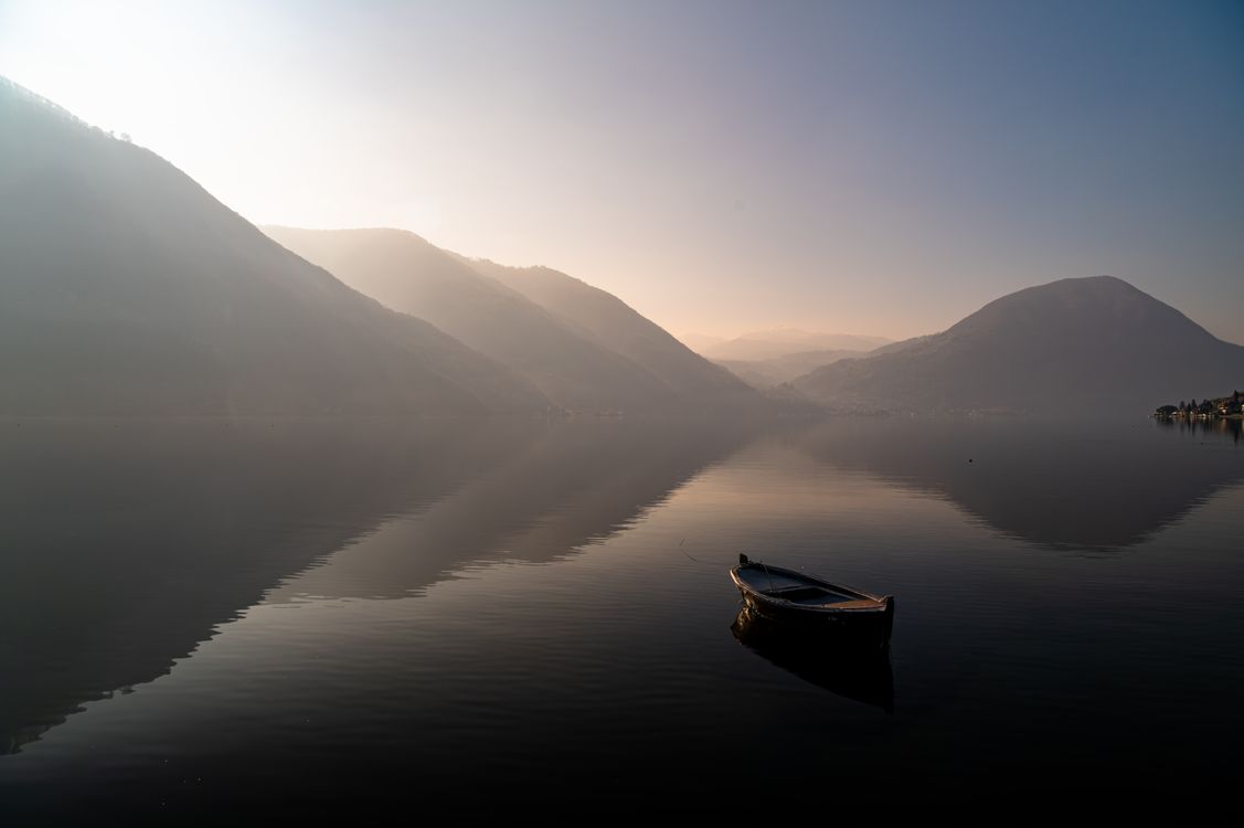 Serene Sunrise Over Tranquil Mountain Lake · Free Stock Photo