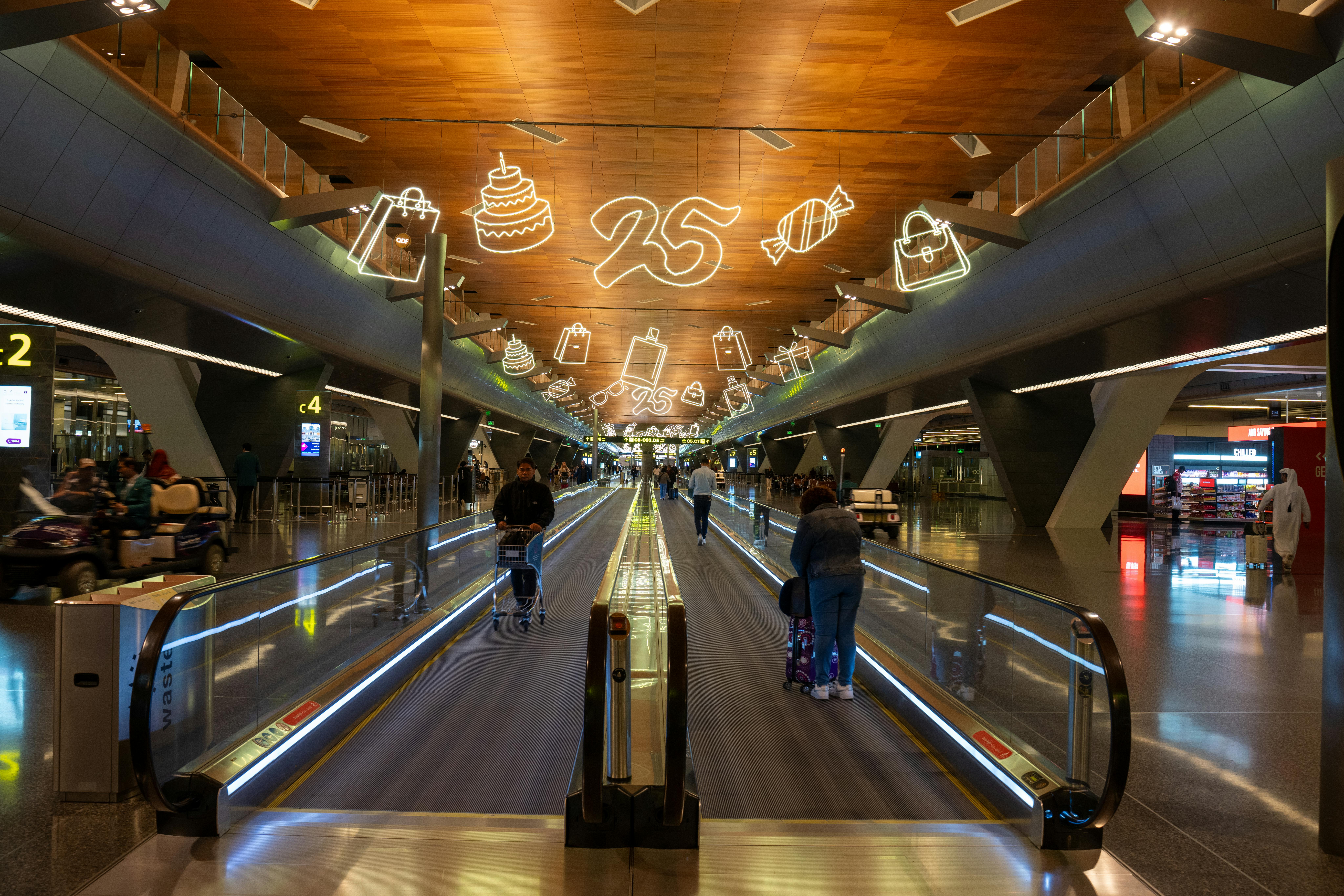 Sleek, modern interior of Celebrity Cruises Terminal 25, with guests relaxing before boarding a ship.