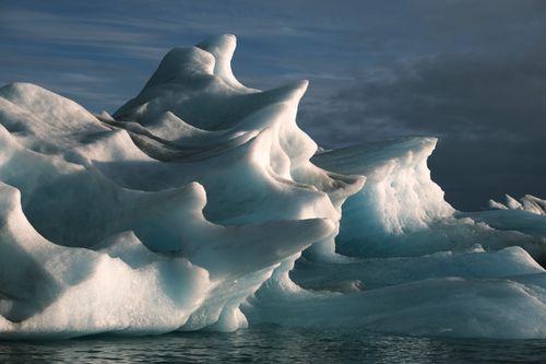 Free Stunning icy formations under dramatic skies in Iceland, showcasing natural beauty. Stock Photo