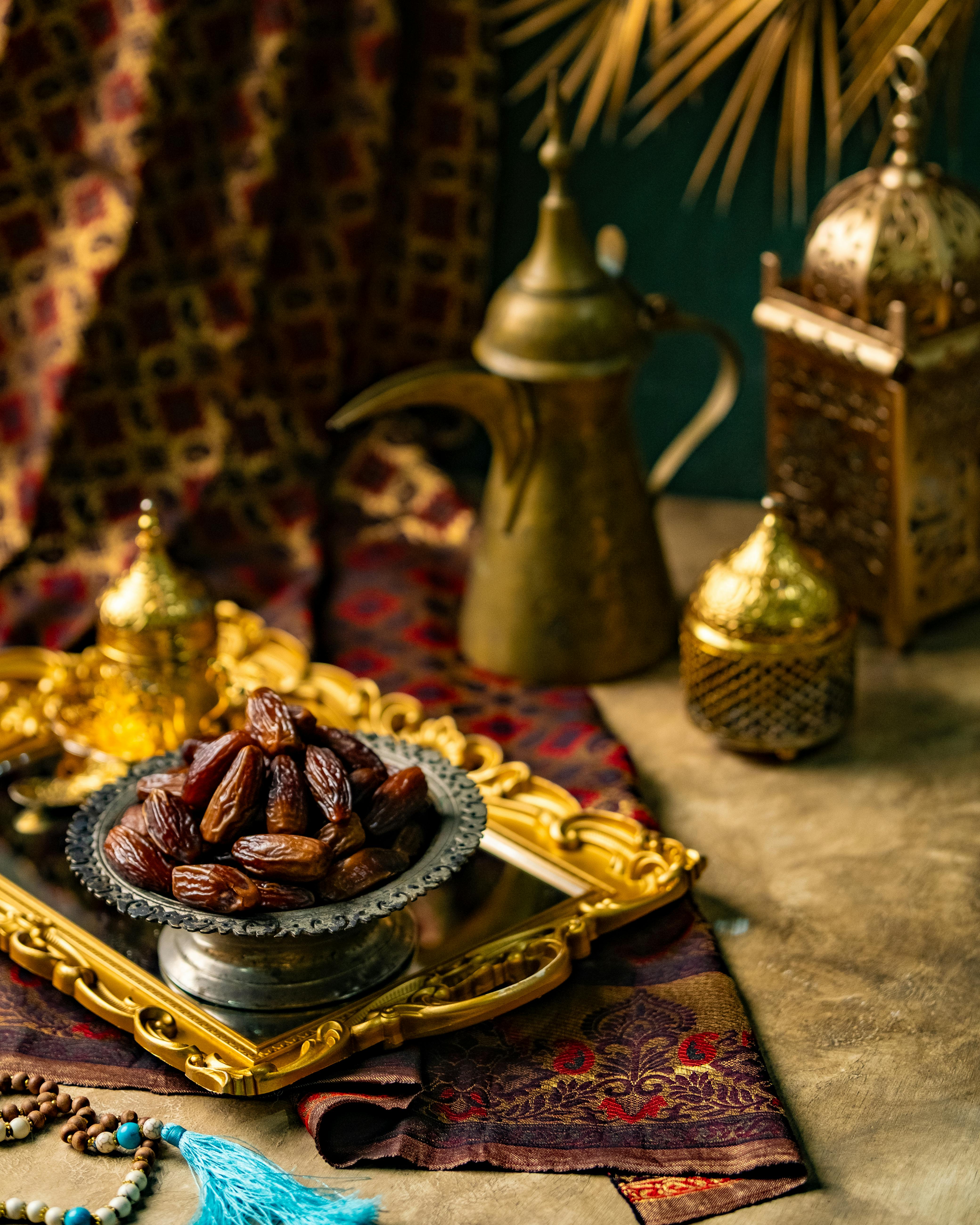 Luxury Arabian dates on an ornate tray with traditional decor, evoking a sense of Middle Eastern culture and festive ambiance.