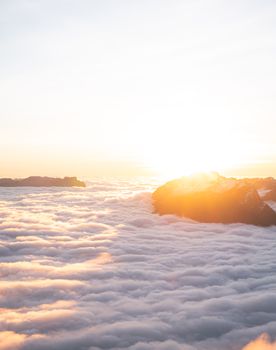 A beautiful sunrise over mountains and clouds in Le Grand-Bornand, France.