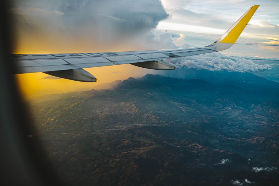 airplane flying over africa landscape sunset