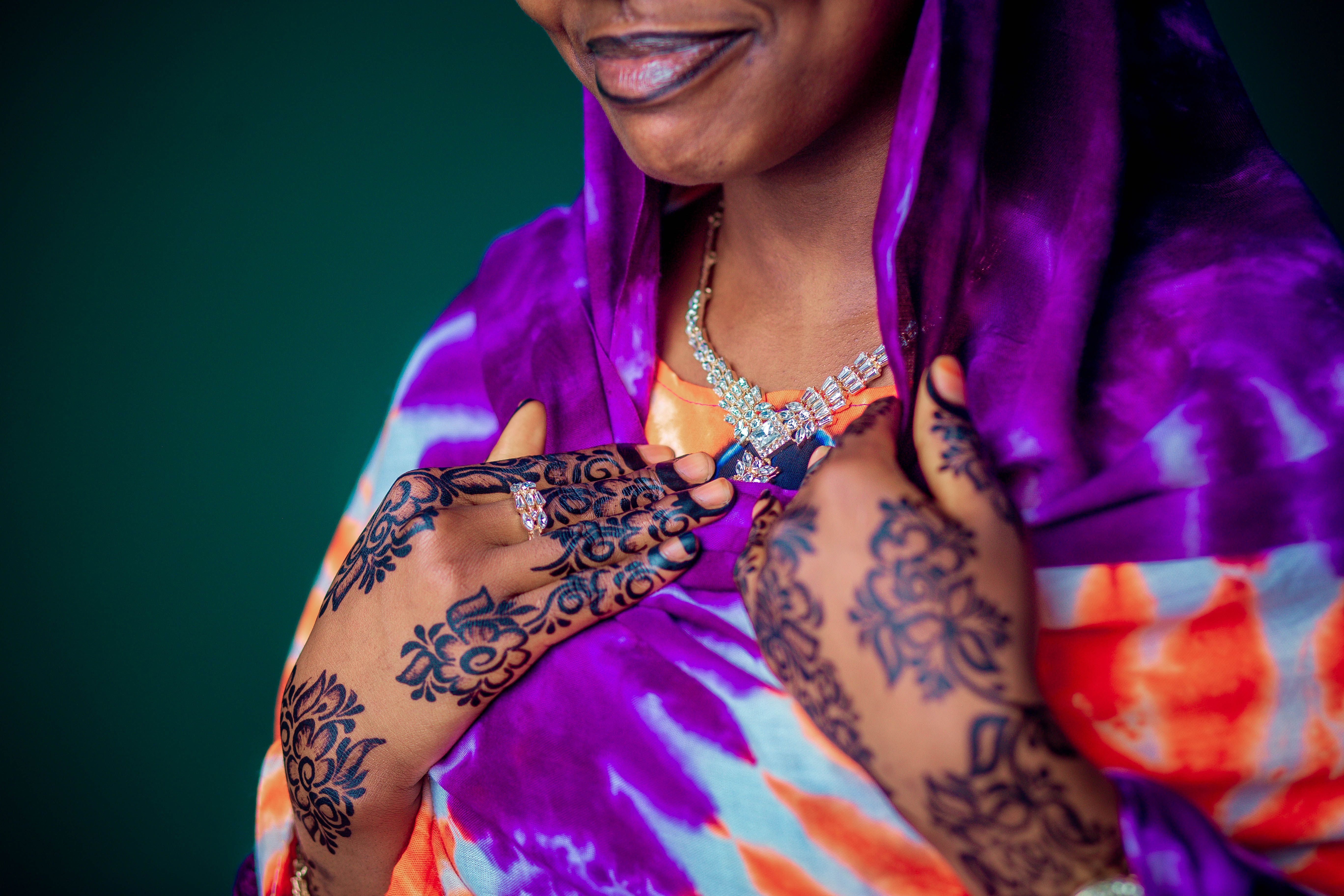 Colorful Attire with Intricate Henna Designs · Free Stock Photo
