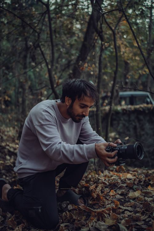 Photographer Capturing Autumn Forest Scene · Free Stock Photo