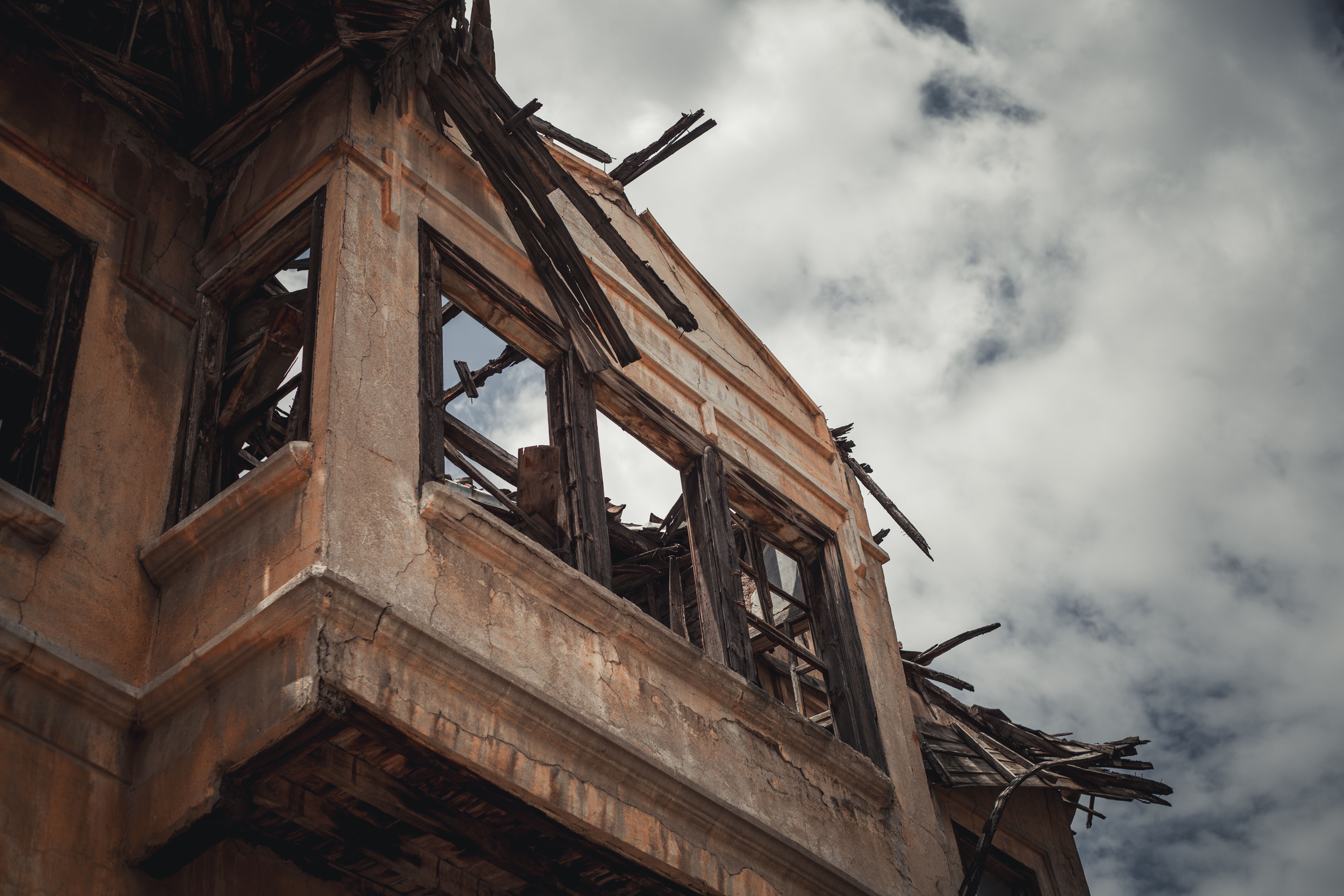 Abandoned Urban Building Against Dramatic Sky · Free Stock Photo
