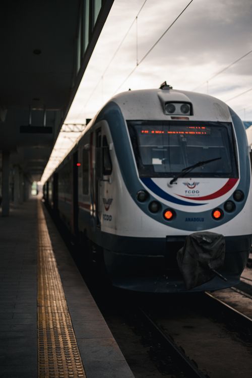 Free A sleek train stationed in a quiet platform in Türkiye during the daytime. Stock Photo