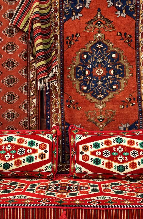 Free Bright rugs with intricate geometric patterns, showcasing cultural textile design. Stock Photo