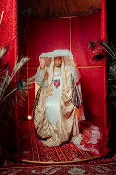 A woman wearing a traditional Middle Eastern bridal outfit in a vibrant setting.