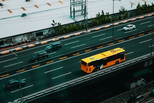 Various vehicles driving on asphalt road