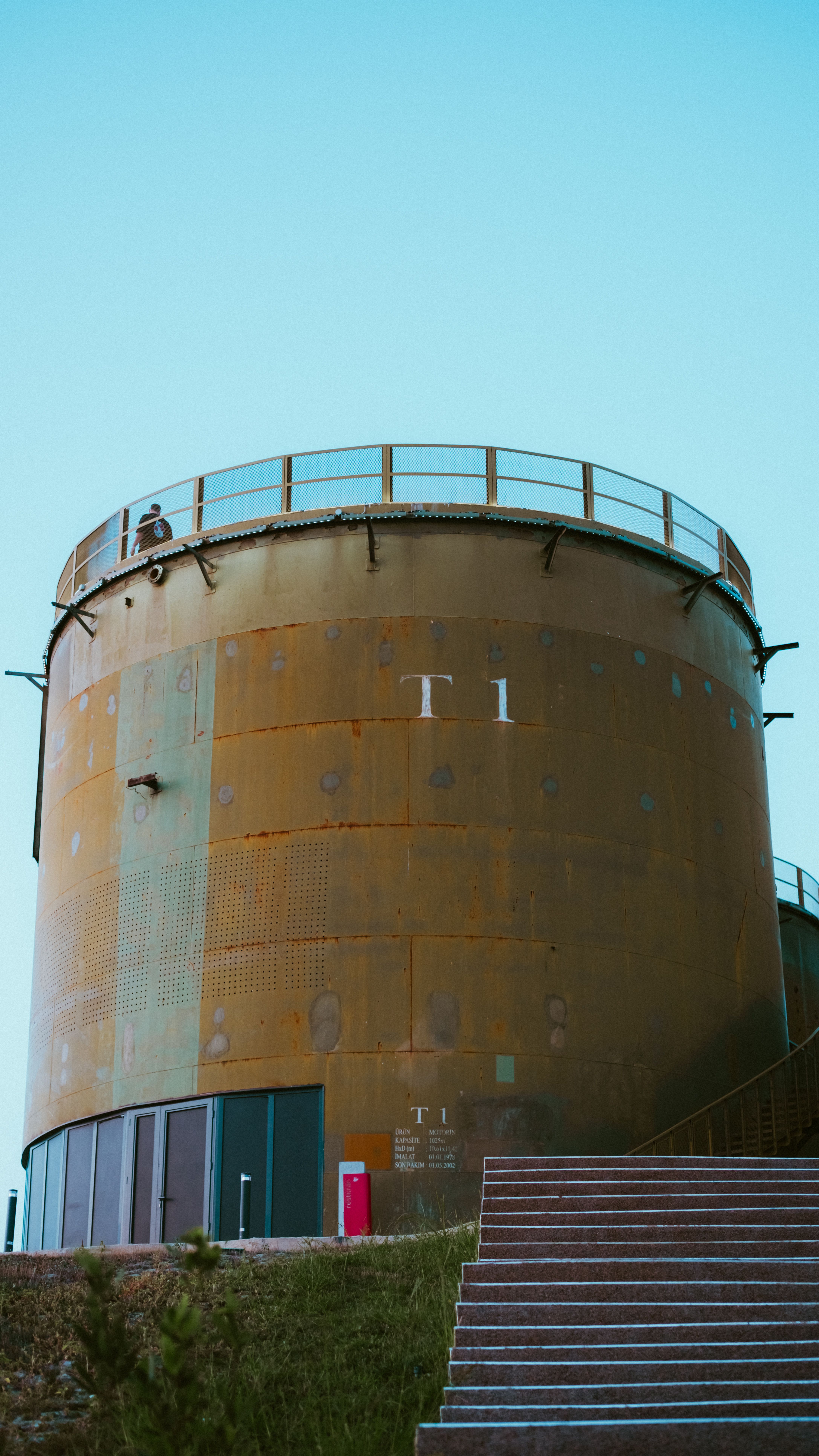 Industrial Water Tank Against Clear Blue Sky
