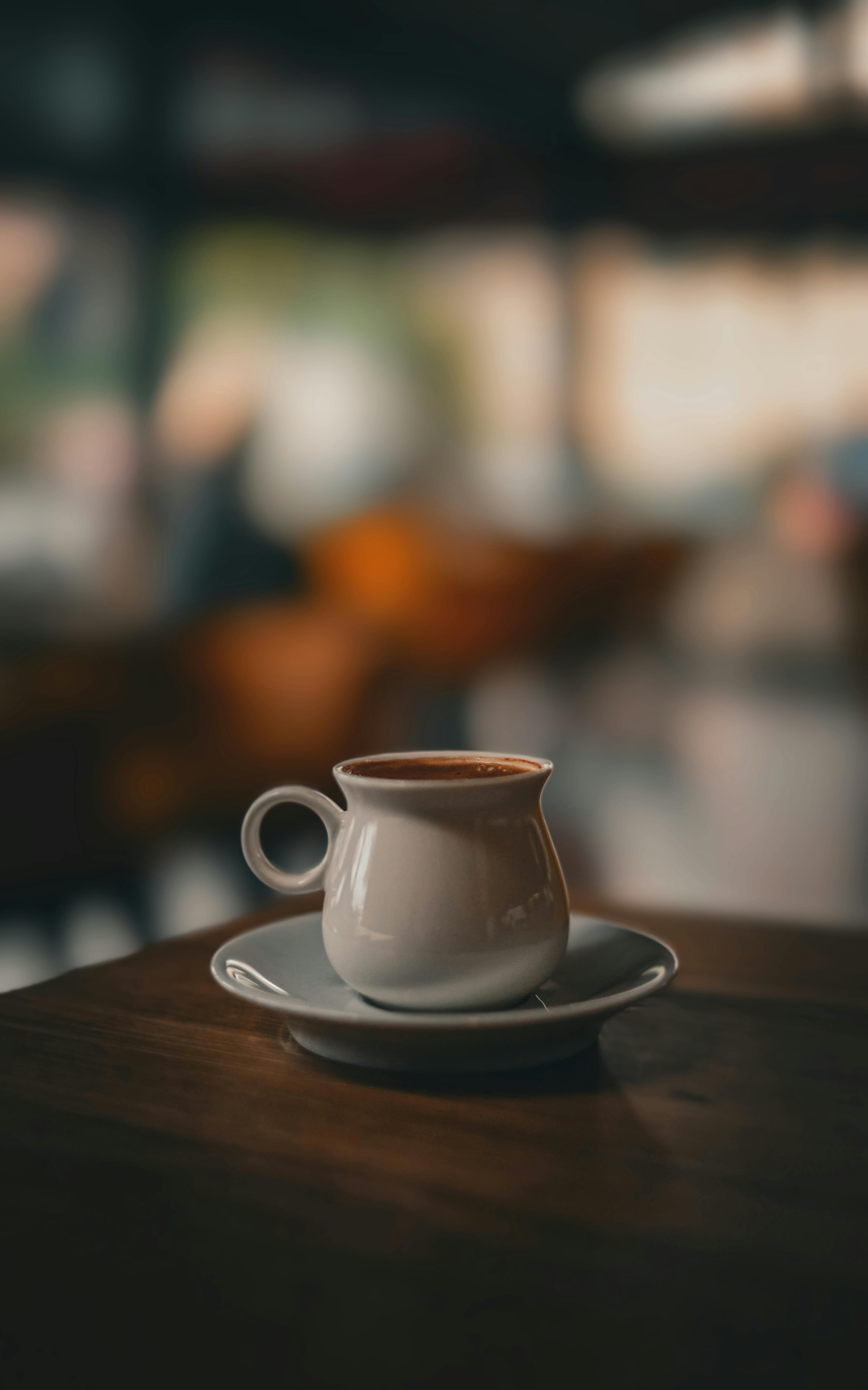 Close-up of Turkish coffee in a cafe with soft, warm lighting.
