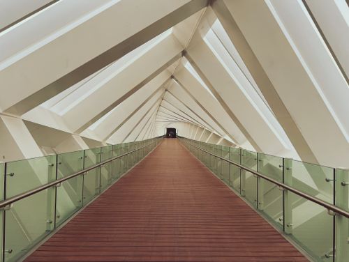 Free Explore this stunning modern bridge with glass railings and geometric design in Dubai. Stock Photo