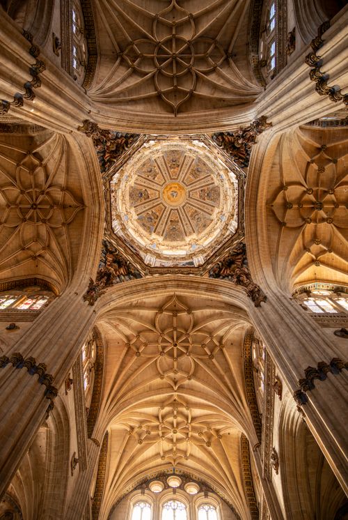 Free Intricate architectural dome of Salamanca Cathedral captured in warm light, showcasing Gothic artistry. Stock Photo