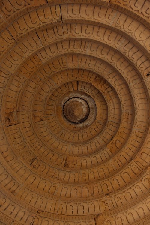 Free Close-up of an ancient spiral stone ceiling with intricate carvings, perfect for architectural themes. Stock Photo