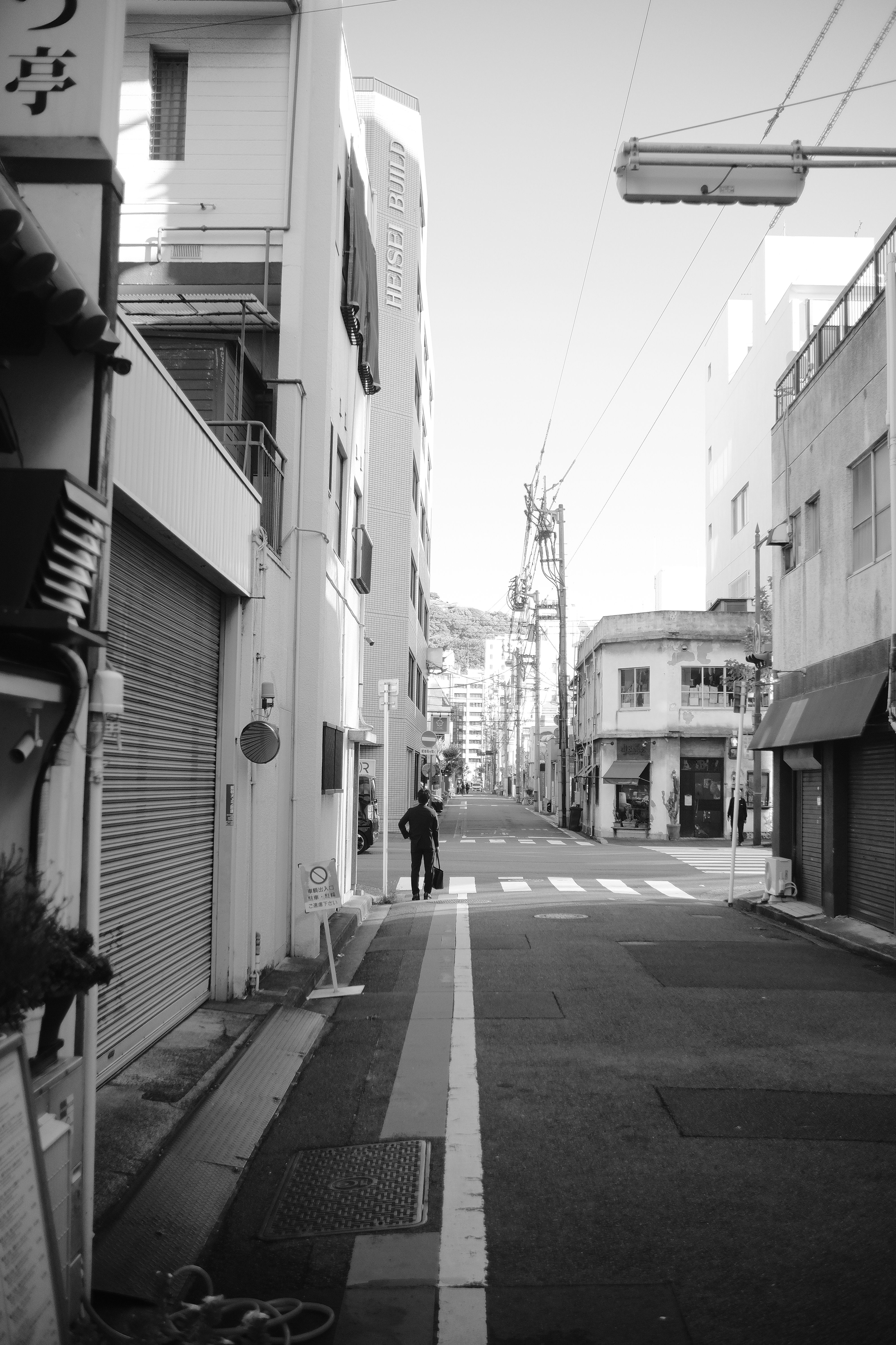 Black and White Urban Street Scene with Pedestrian · Free Stock Photo