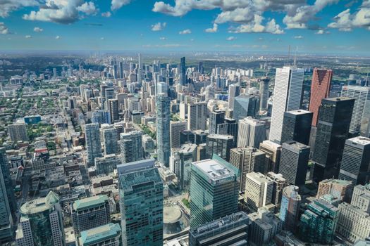 A breathtaking summer aerial view of the Toronto skyline showcasing modern skyscrapers and urban landscape.