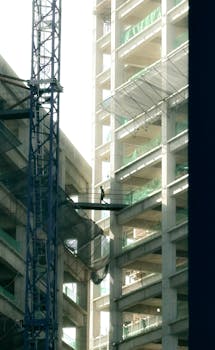 A construction worker on a high-rise building in Puebla, Mexico, highlighting urban development.