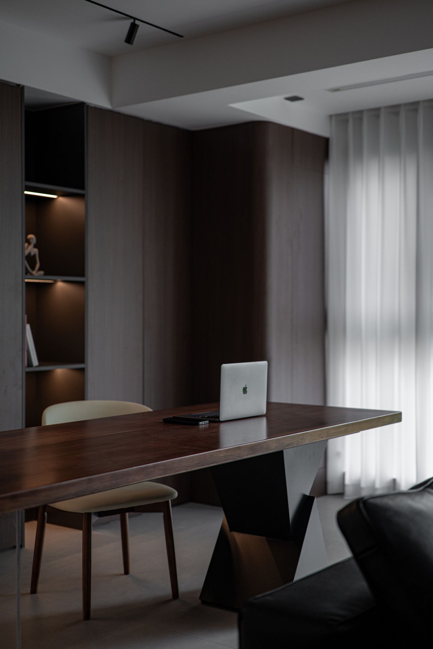 Contemporary home office interior with modern desk and shelves