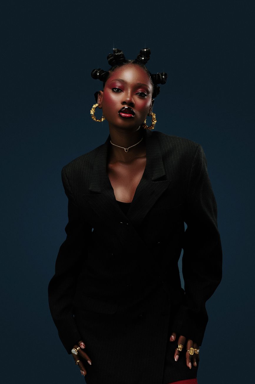 Gold Hour editorial look with black coat