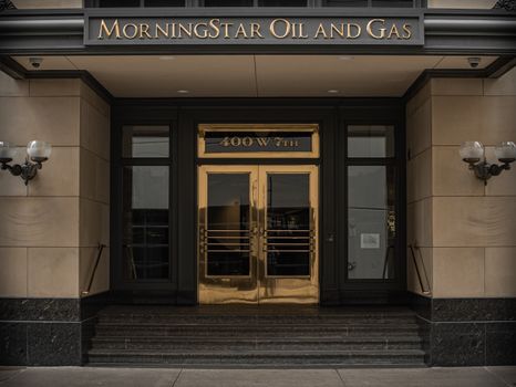 Entrance of MorningStar Oil and Gas at 400 W 7th, depicting a classic and formal architectural style. — photo by Gavin Young