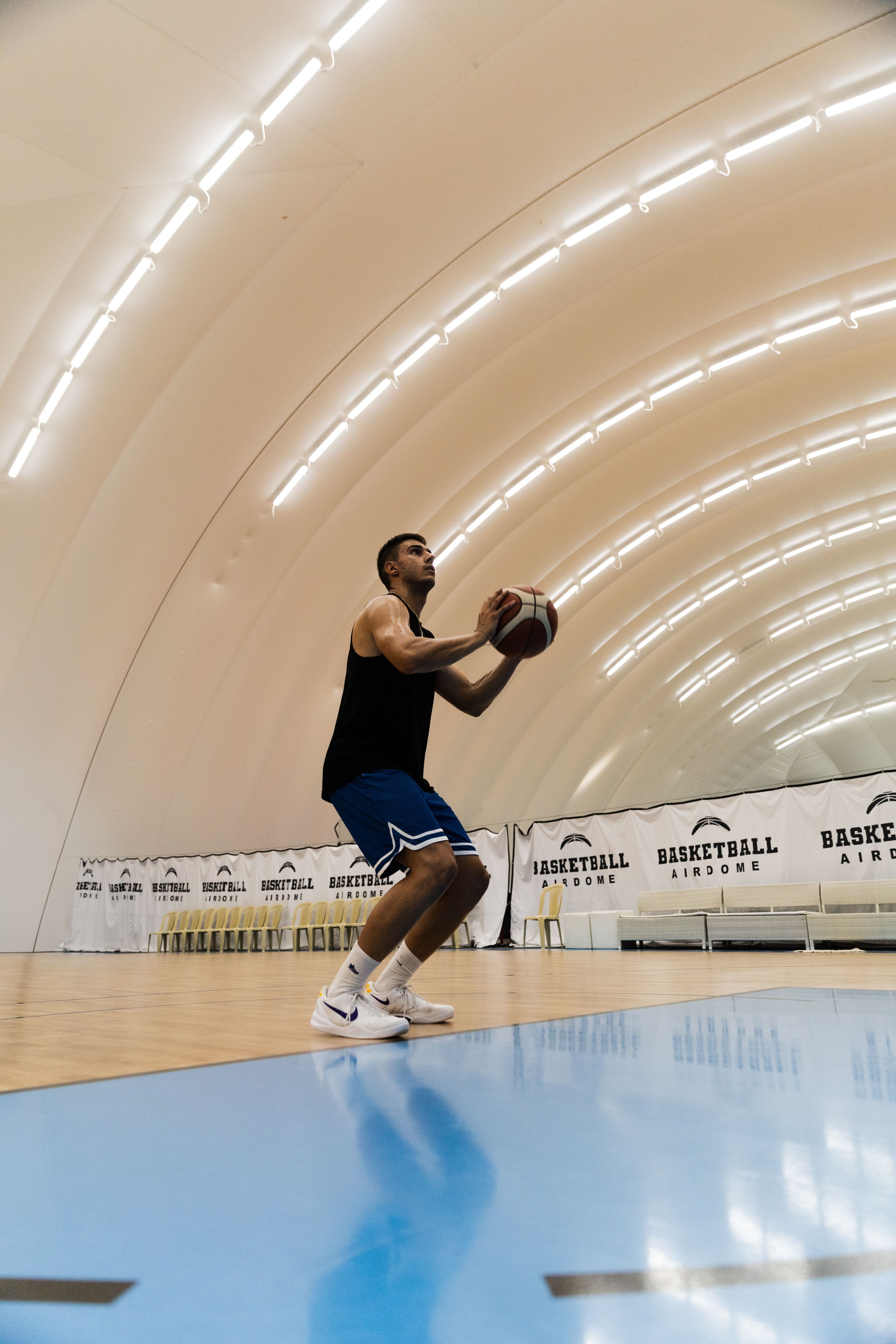 Athlete Practicing Free Throws in Indoor Basketball Arena · Free Stock ...