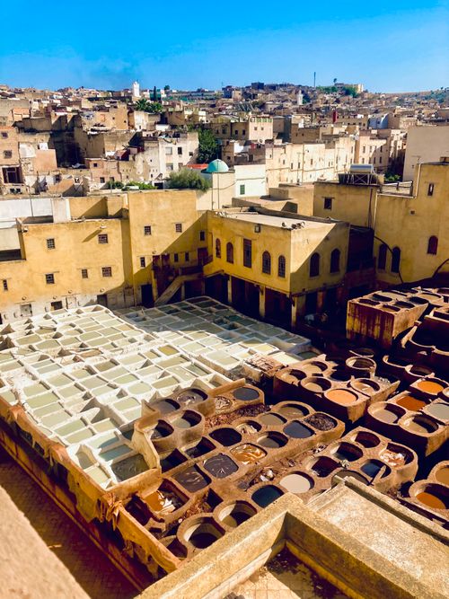 Free Aerial view of Fes Tanneries, showcasing vibrant colors and traditional Moroccan architecture. Stock Photo