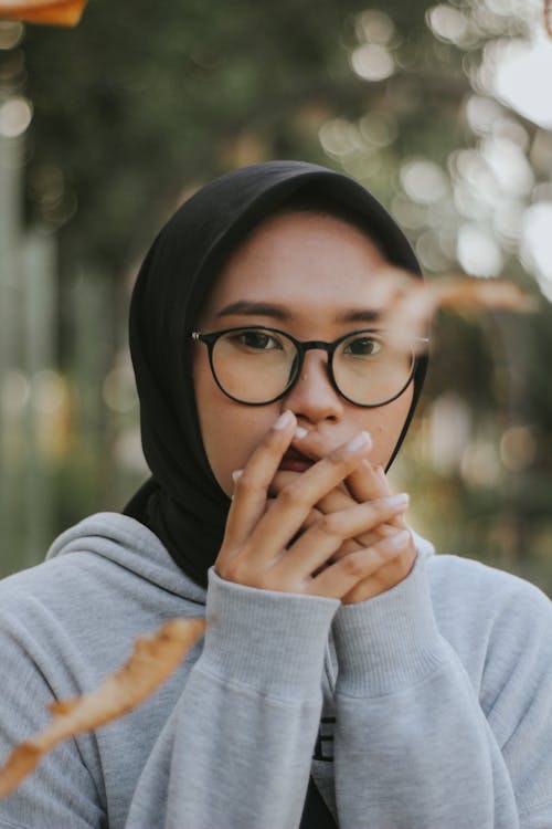 Free Woman Wearing Eyeglasses and Black Hijab Stock Photo