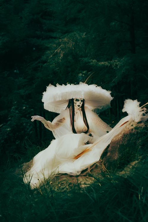 Ethereal Woman in Mystical Forest Setting · Free Stock Photo