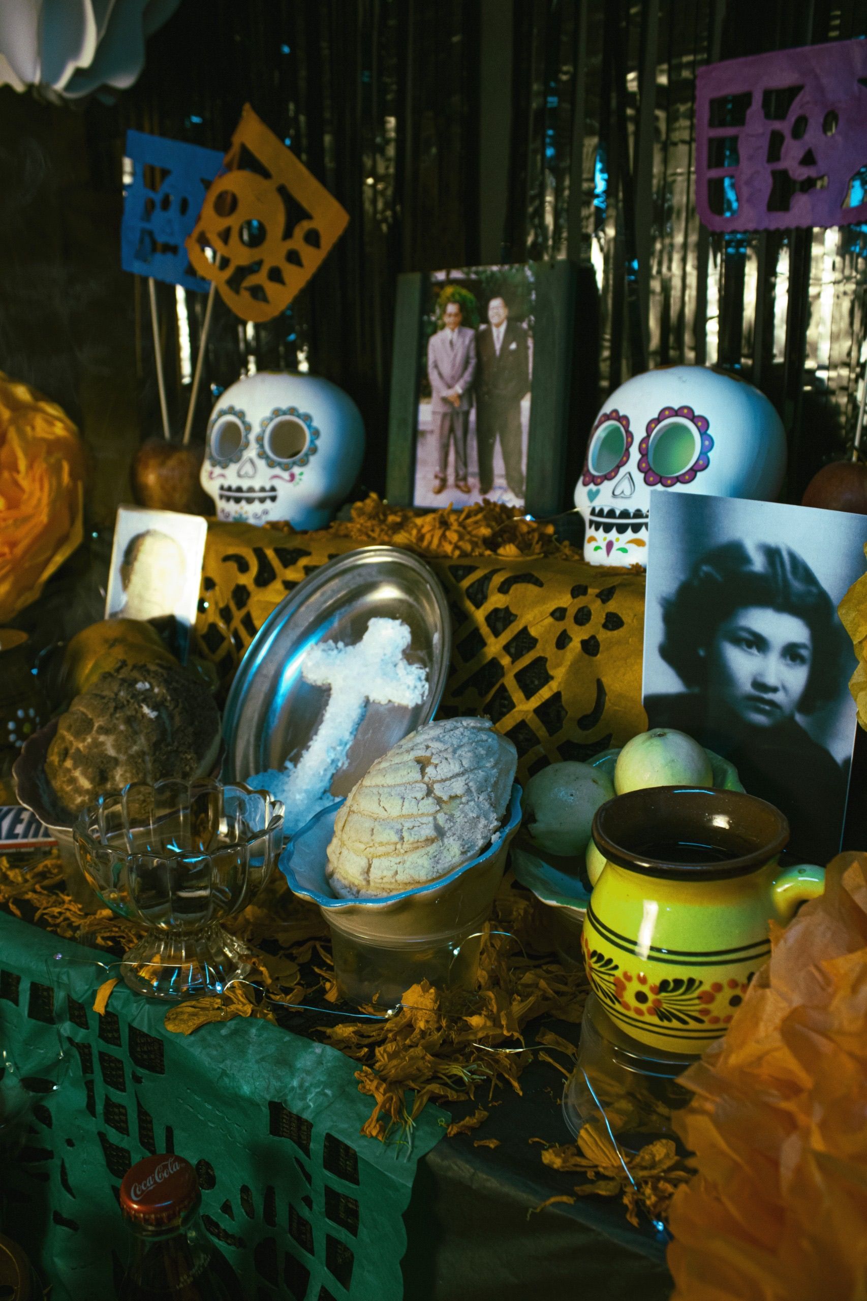 Day of the Dead altar with sugar skulls, photographs and traditional offerings in Mexico