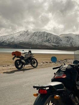 Motorbike journey through Leh with stunning Himalayan mountain scenery.