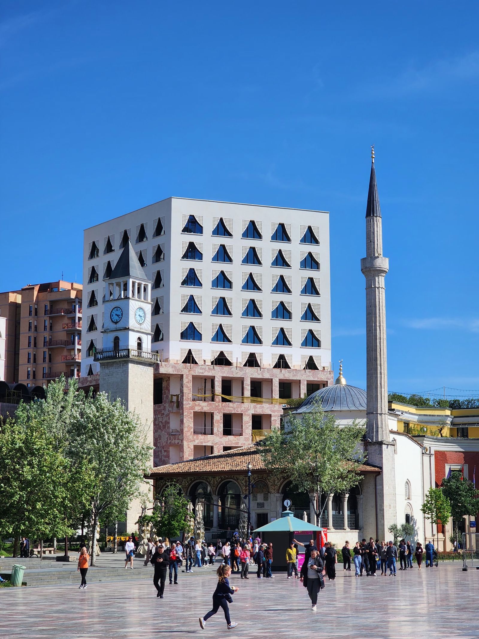 Skanderbeg Square in Tirana with the Clock Tower and Et’hem Bey Mosque on a sunny day