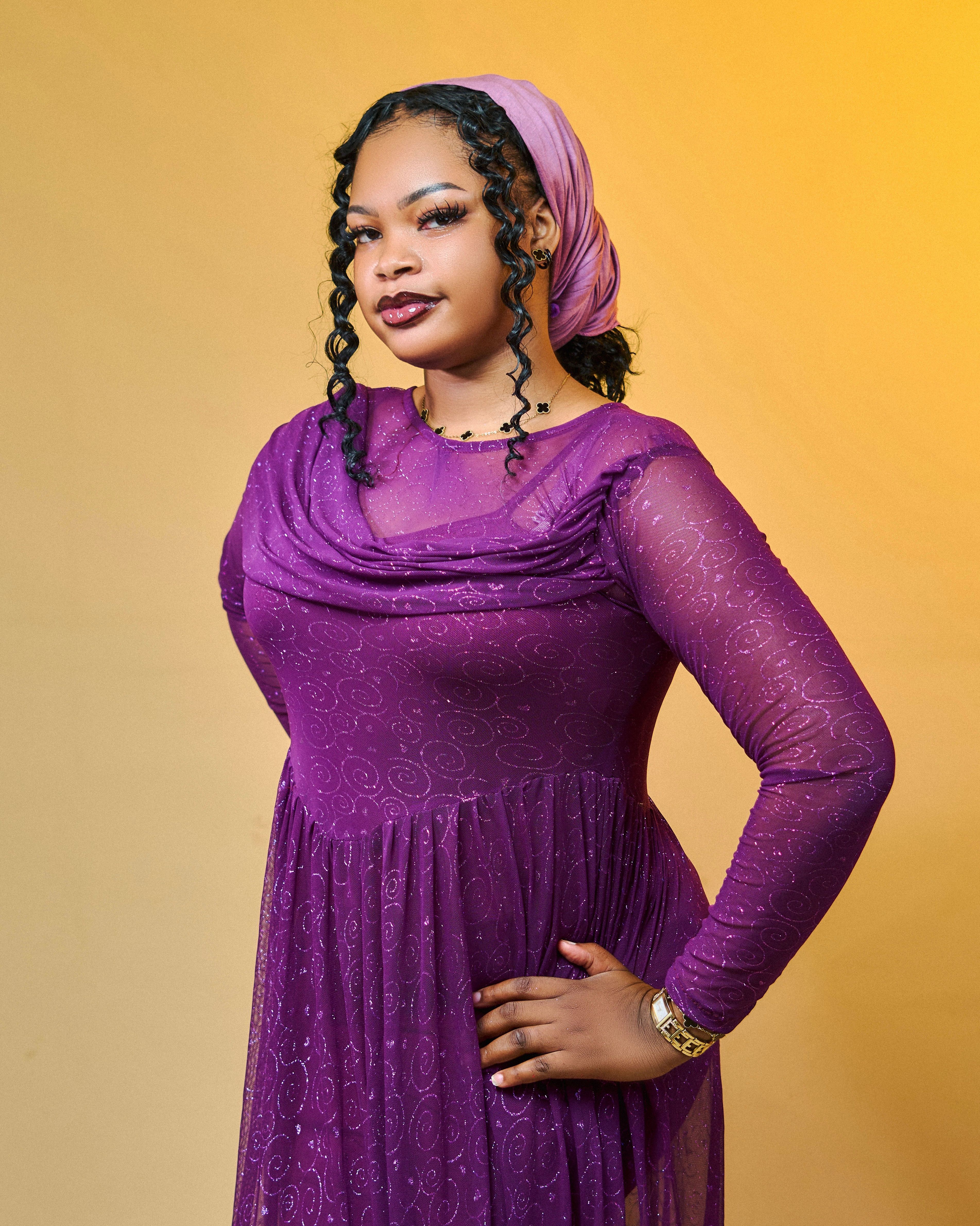 Elegant Woman in Purple Dress Posing · Free Stock Photo