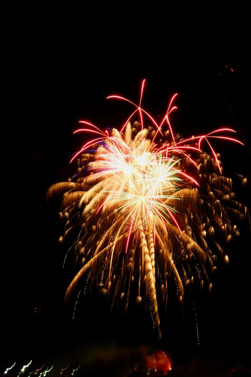Free Colorful fireworks burst in a dark night sky, perfect for festive occasions. Stock Photo