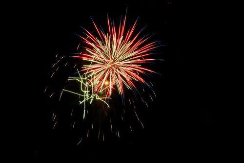 Free Colorful fireworks burst vividly against the dark night sky, celebrating a festive occasion. Stock Photo