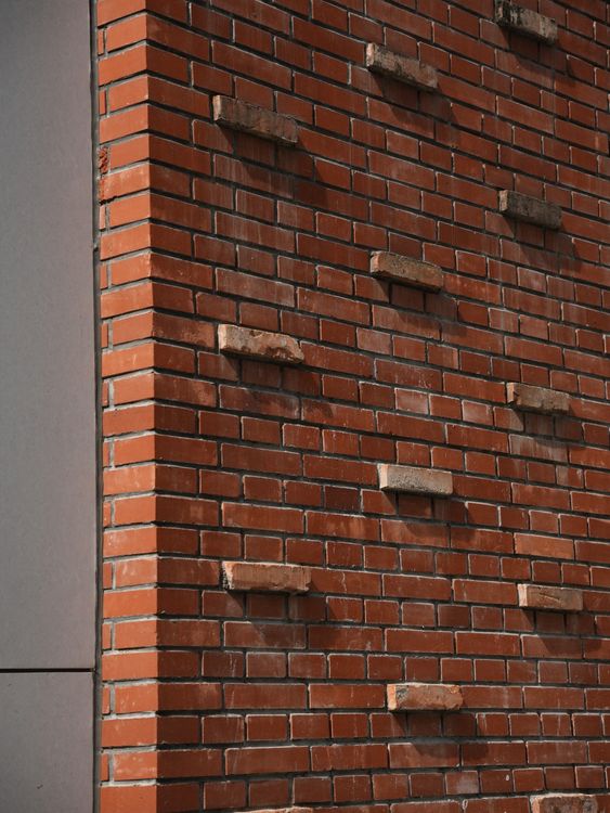 Brick Wall with Unique Staggered Pattern · Free Stock Photo