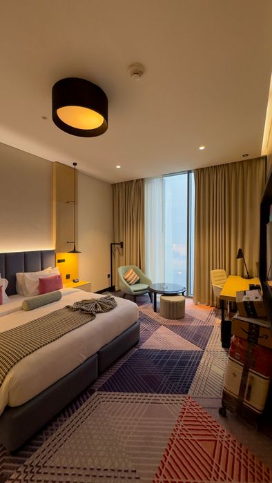 Modern hotel room with bed and elegant lighting