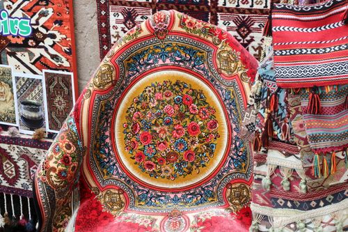 Free Colorful Persian rugs and textiles gallery showcasing intricate patterns and vibrant designs. Stock Photo
