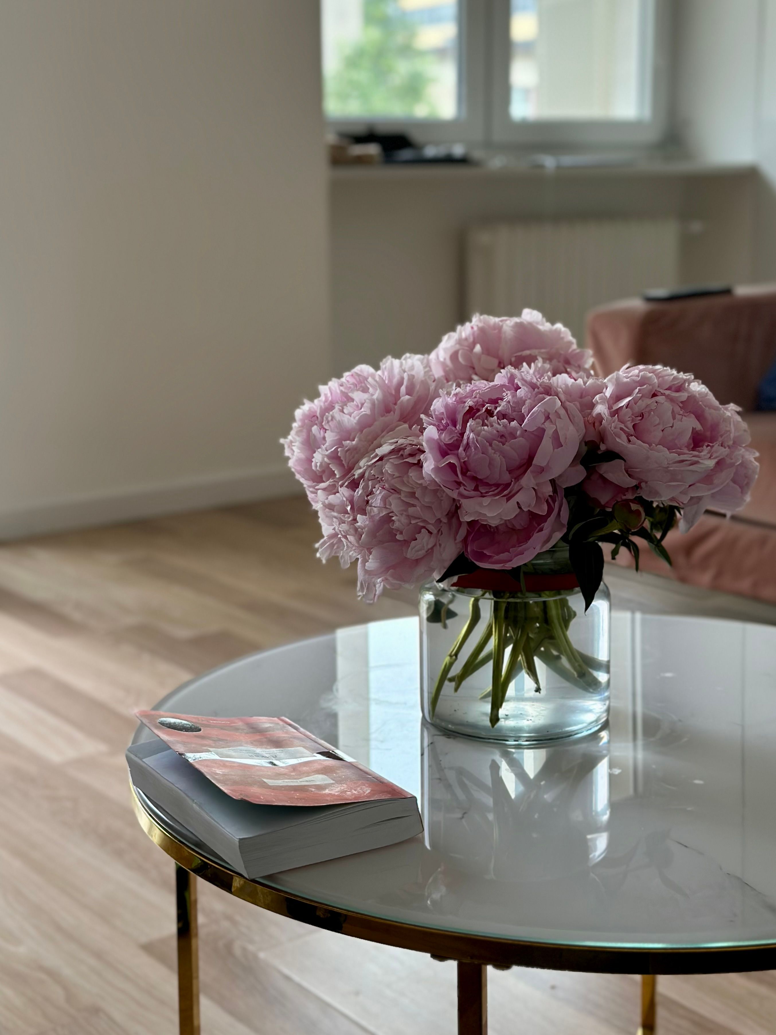 Cozy Interior with Peonies on a Coffee Table · Free Stock Photo