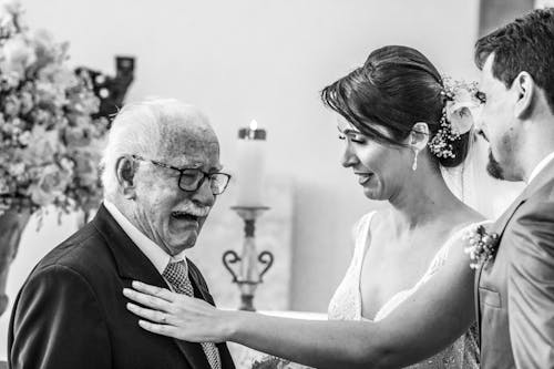 Free Man Crying in Front of Newly Wed Couple Stock Photo