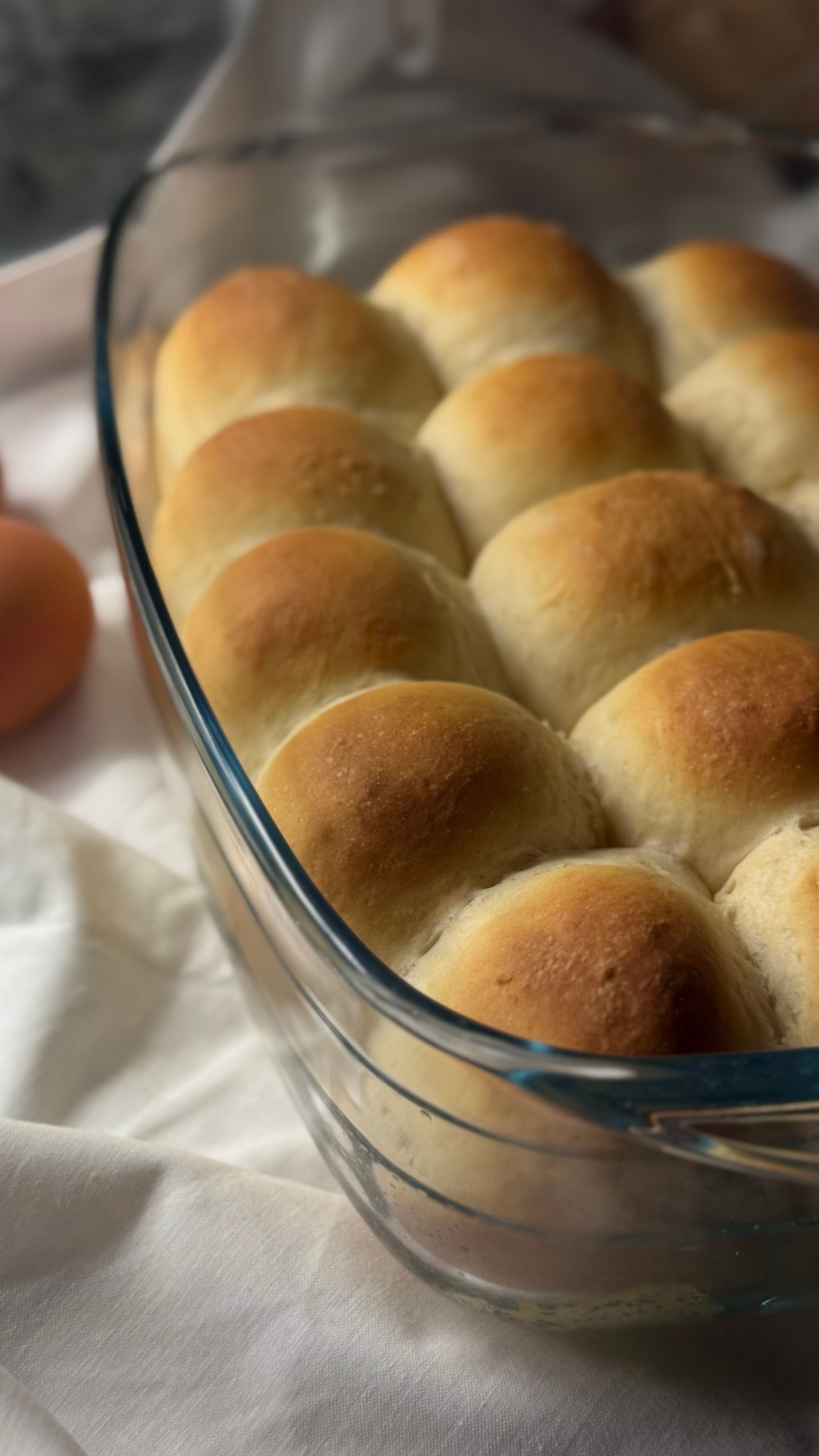 Golden Baked Dinner Rolls in Glass Dish · Free Stock Photo