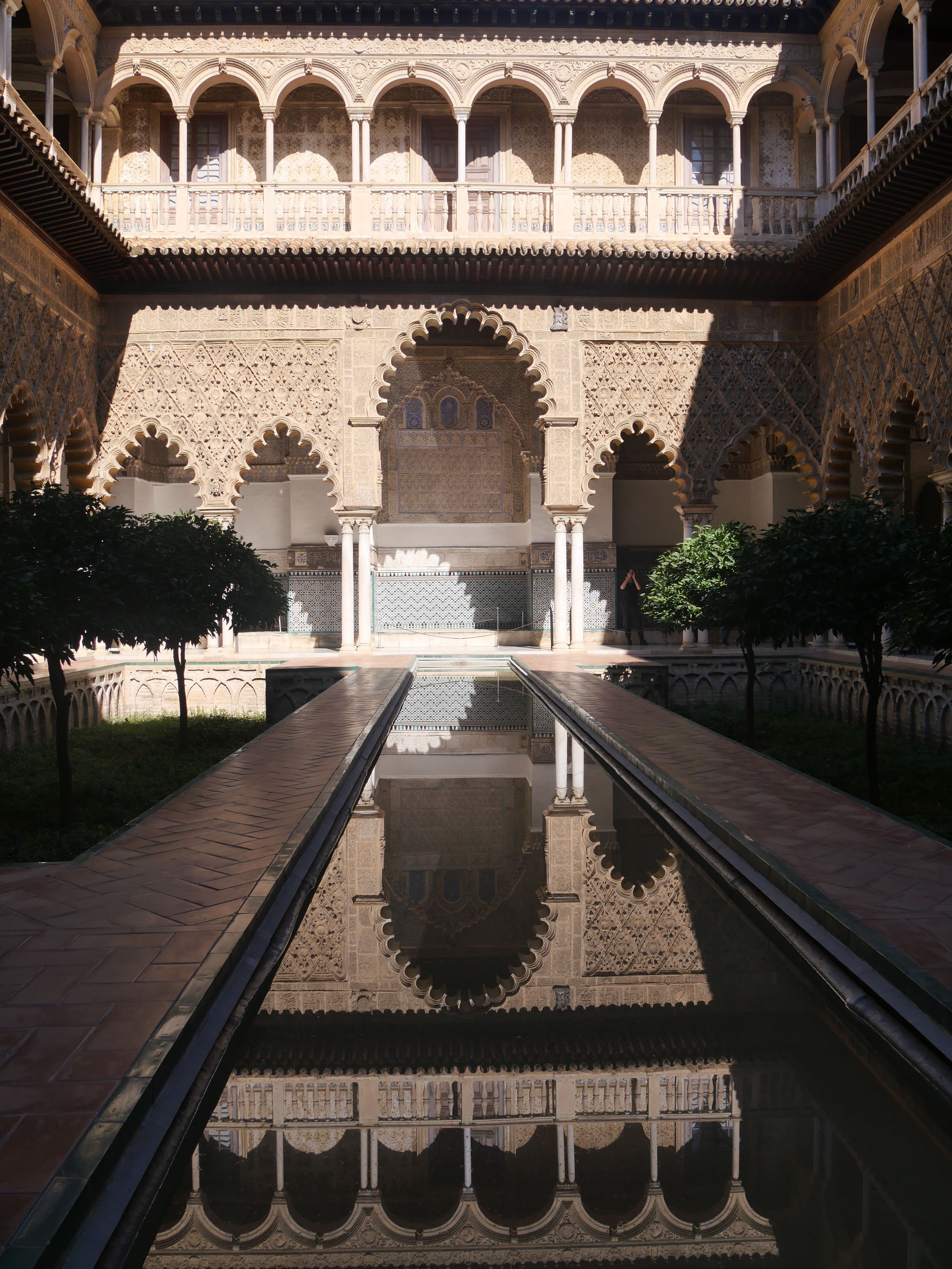 Explore the exquisite Mudejar architecture of Alcazar's Patio de las Doncellas in Seville, Spain.