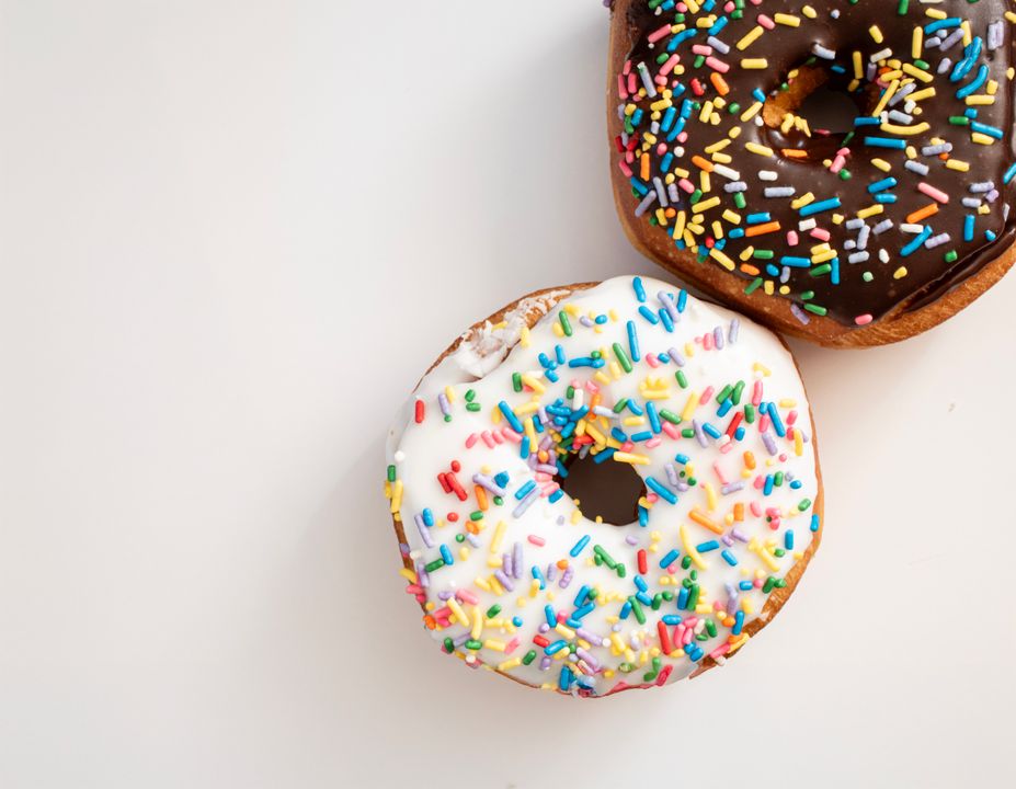 Bomboloni vs Doughnuts: How to Make Both and When to Serve Each 1 Side-by-side cross-section of a bomboloni and a glazed doughnut on a white surface