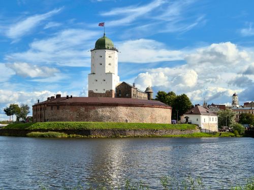 Free Explore the historic Vyborg Castle on a sunny day, surrounded by a serene river view. Stock Photo