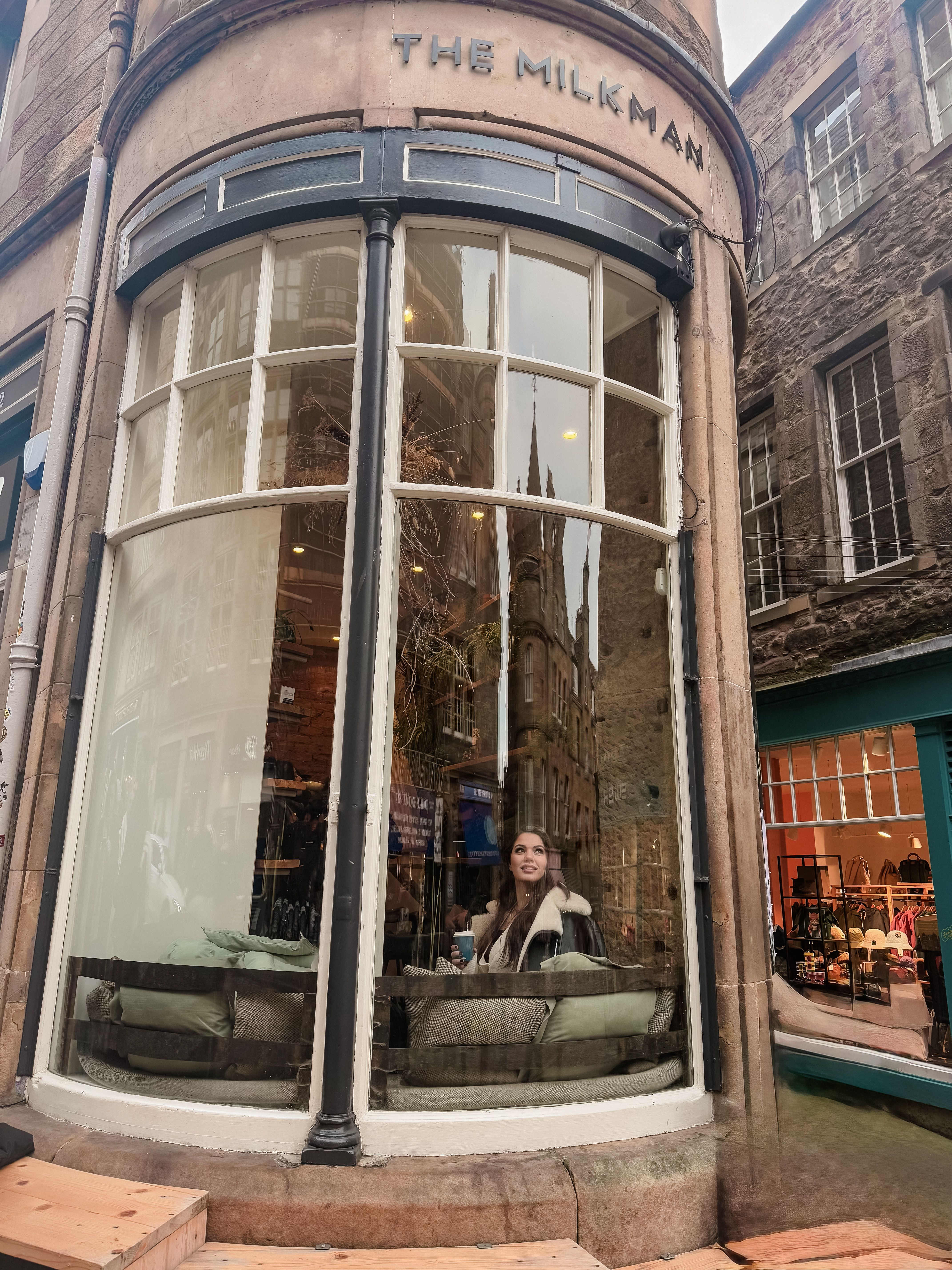 Cozy Coffee Shop Scene with Urban Reflection · Free Stock Photo