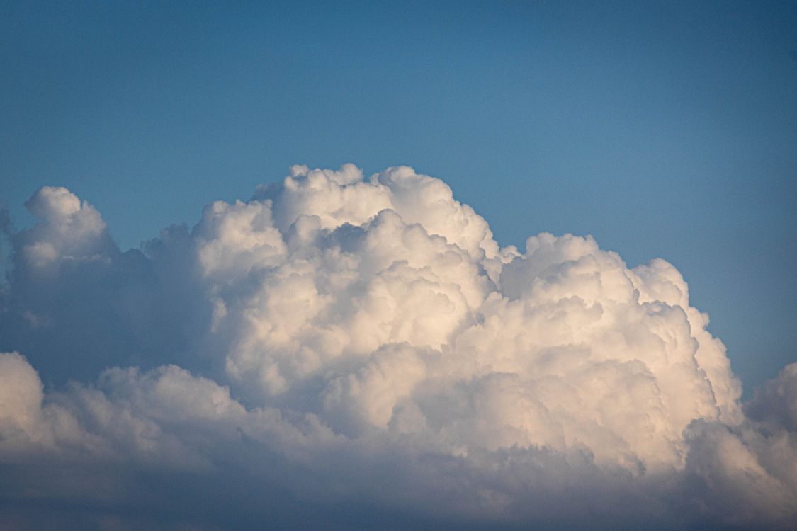 Fluffy Cumulus Clouds in Blue Sky · Free Stock Photo