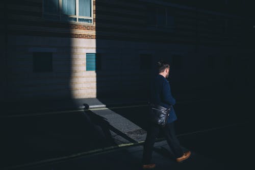 Person in Blue Blazer and Black Pants Walking