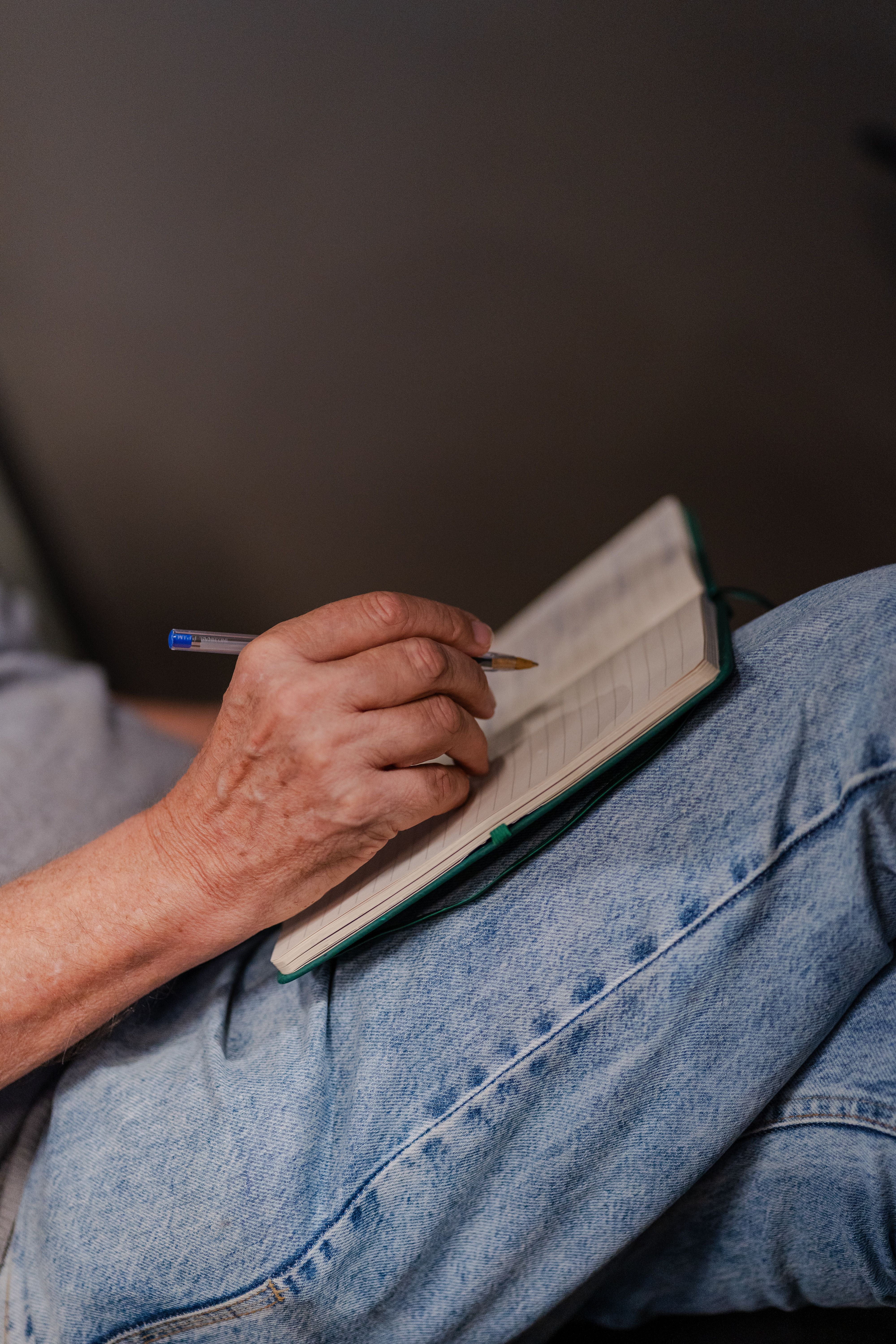 Adult Writing Notes in Journal at Home · Free Stock Photo