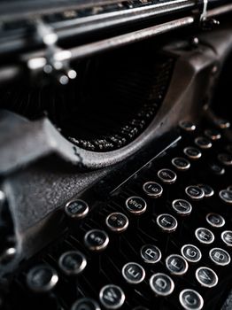 Detailed close-up of vintage typewriter keys with dramatic lighting. Perfect for retro and vintage themes.