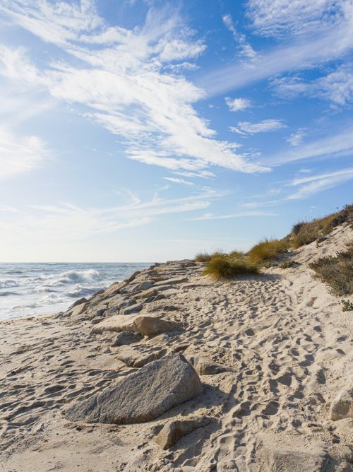 Free Serene view of sandy beach and ocean waves at Castelo do Neiva, Portugal. Stock Photo
