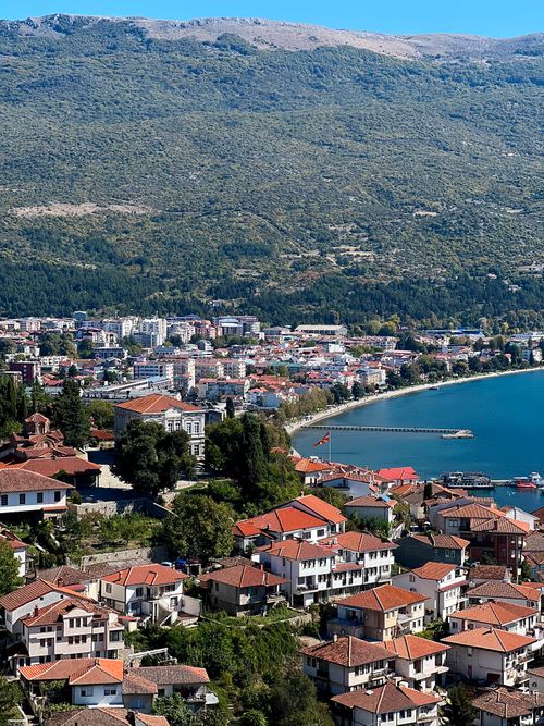 Free Stunning aerial view of Ohrid city and Lake Ohrid embracing the Balkan Mountains. Stock Photo
